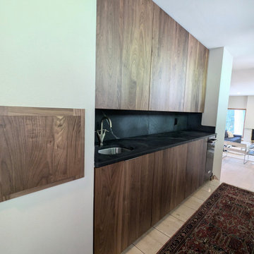 Contemporary Kitchen Remodel Done in a Walnut Slab Door