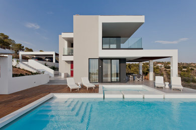 Trendy rectangular pool photo in Other