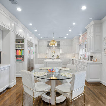 Bright and Elegant Kitchen with Glass Dining Table and Custom Cabinetry