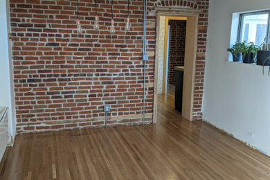 Living room - transitional light wood floor living room idea in Milwaukee