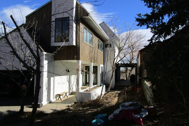 Inspiration for a mid-sized transitional white two-story mixed siding exterior home remodel in Denver
