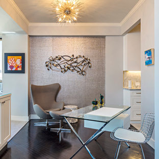 Design ideas for a medium sized modern home office and library in New York with beige walls, dark hardwood flooring, no fireplace and a freestanding desk.