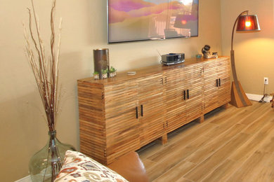 Living room - mid-sized eclectic open concept porcelain tile and beige floor living room idea in Phoenix with a bar, beige walls and a wall-mounted tv