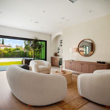 Living Room with Plaster Walls Opening to the Pool Terrace