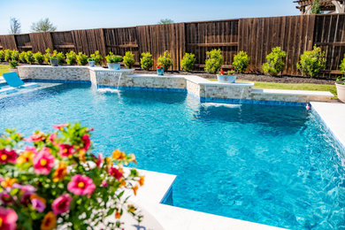 Inspiration for a large timeless backyard stone and rectangular hot tub remodel in Houston