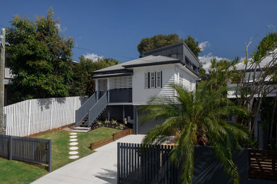 Transitional house exterior in Brisbane with a metal roof.