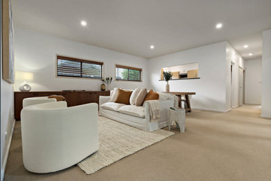 This is an example of a mid-sized contemporary formal open concept living room in Newcastle - Maitland.
