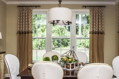 Inspiration for a mid-sized traditional dining room with brown walls, dark hardwood floors and brown floor.