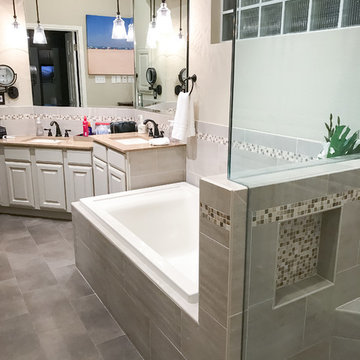 Custom bathroom remodel with Walk in shower and jet tub with grey tile surround