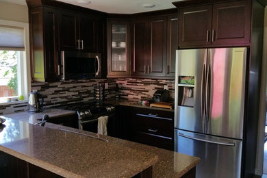 Inspiration for a small transitional u-shaped eat-in kitchen remodel in Vancouver with an undermount sink, shaker cabinets, dark wood cabinets, quartzite countertops, brown backsplash, metal backsplash, stainless steel appliances and a peninsula