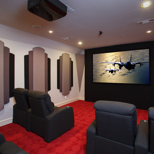 Design ideas for a medium sized contemporary enclosed home cinema in Little Rock with grey walls, carpet, a projector screen and red floors.