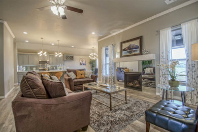 Inspiration for a mid-sized transitional open concept vinyl floor living room remodel in Oklahoma City with gray walls and a standard fireplace