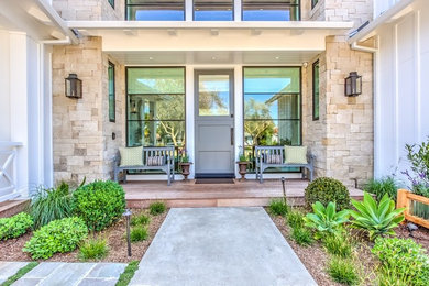 Example of a large country mixed siding house exterior design in Orange County