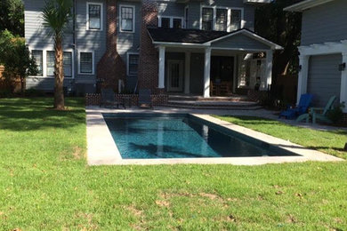 Hot tub - mid-sized transitional backyard concrete paver and rectangular hot tub idea in Jacksonville