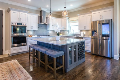 Kitchen - modern l-shaped medium tone wood floor and brown floor kitchen idea in Other with an undermount sink, shaker cabinets, gray cabinets, gray backsplash, stainless steel appliances and an island