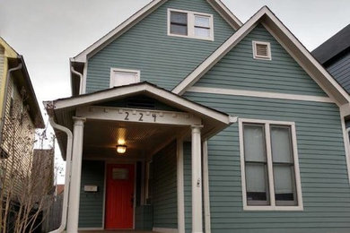 Example of a farmhouse exterior home design in Indianapolis