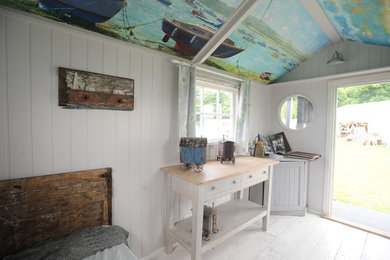 Beach style home design photo in Sussex