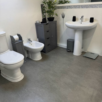 The bathroom fitted with Secura Polished Concrete vinyl At Aller - Somerset