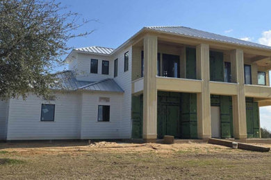 Large elegant two-story house exterior photo in Houston