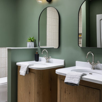 Cambridge, MA Green Bathroom Vanity Detail with Arched Mirrors – Whole Home Reno