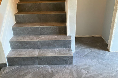 Inspiration for a mid-sized tile straight staircase remodel in Portland with tile risers