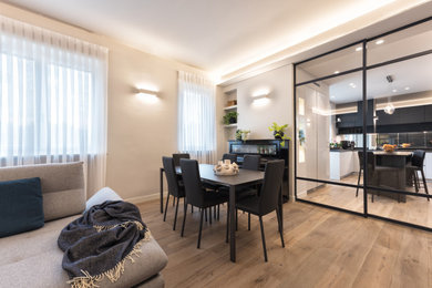 Dining room - modern light wood floor dining room idea in Turin