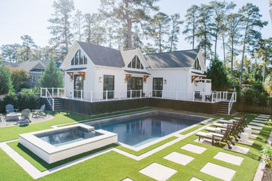 Small contemporary white one-story concrete fiberboard and board and batten exterior home idea in Other with a shingle roof and a gray roof