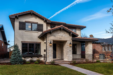 Example of a transitional home design design in Denver