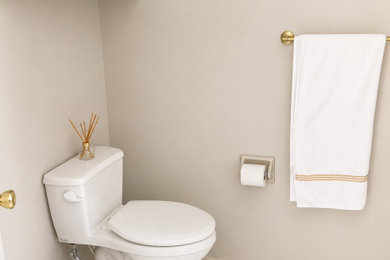 Example of a mid-sized minimalist master white tile and porcelain tile double-sink, porcelain tile and white floor bathroom design in Kansas City with shaker cabinets, beige cabinets, a built-in vanity, a two-piece toilet, beige walls, an undermount sink, granite countertops and white countertops
