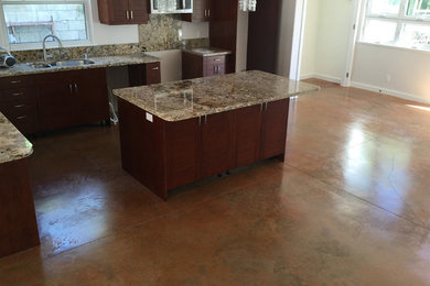 Transitional kitchen in Hawaii with concrete floors.