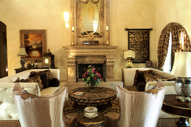 Living room - mediterranean formal marble floor living room idea in San Diego with a standard fireplace and a concrete fireplace
