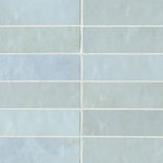 Bedrosians Tile and Stone - Cloe 2.5"x8" Artisan Ceramic Subway Tile, Baby Blue - The Cloe Collection is glazed ceramic wall tile characterized by its brilliant colors, smooth gloss finish and interesting variations in hues and tones. Its eight colors: White, Creme, Baby Blue, Grey, Pink, Green, Blue and Black, can be used in a wide range of combinations. For a pop of pattern, we've included a 2.5"x8" black and white Loire deco. Trim out your projects with the 1/2"x8 Jolly Miter Edge Trim in a gloss finish.