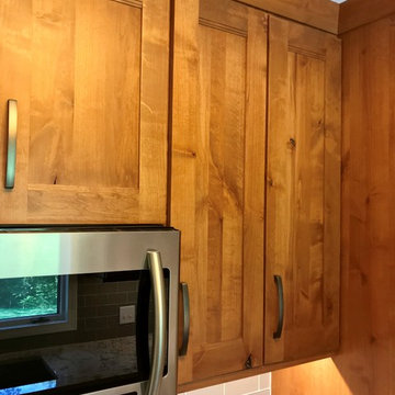 Dura Supreme Cabinets Knotty Alder Butternut Romanix Granite Galley Kitchen