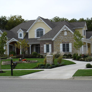 French Colonial Landscape with year round color and natural flagstone wall