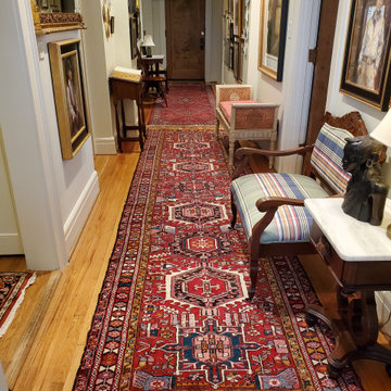 Simplicity of complimentary Persian Rugs grounds gallery foyer... Welcome Home!