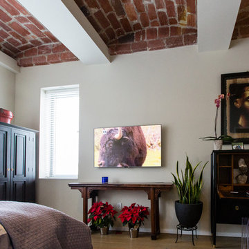 smart tv mounted on the wall, components are out of sight.