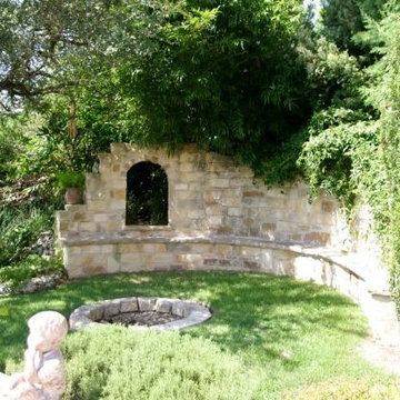 Secret Garden with fire pit and wall seating