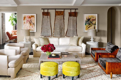 Example of a large eclectic formal and enclosed dark wood floor and brown floor living room design in Orange County with beige walls, no fireplace and no tv