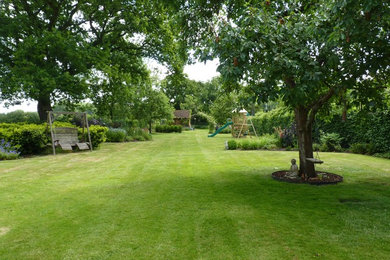 Large country backyard partial sun garden in Hertfordshire.