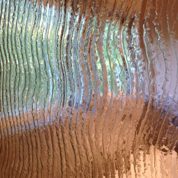 Cascading water shower wall