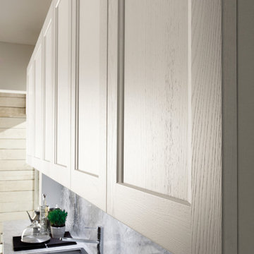Contemporary off white kitchen with carrara marble countertop