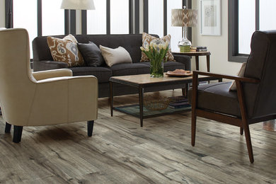 Photo of a mid-sized transitional formal open concept living room in New York with white walls and light hardwood floors.