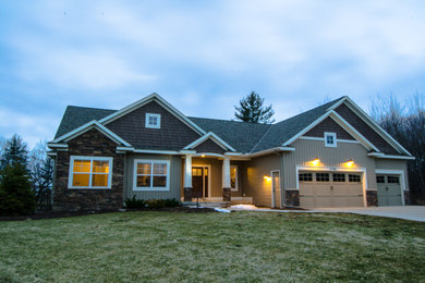 Mid-sized elegant beige one-story vinyl exterior home photo in Grand Rapids
