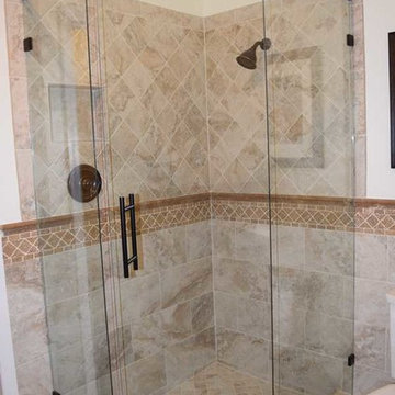 Corner Shower with Porcelain Field Tile and Travertine Trim
