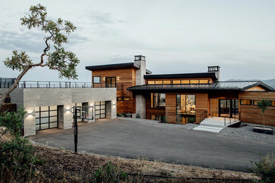 Inspiration for a large contemporary multicolored two-story mixed siding exterior home remodel in Salt Lake City with a green roof