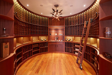 Inspiration for a large timeless light wood floor wine cellar remodel in Other
