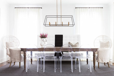 Mid-sized modern dining room in Nashville with white walls and dark hardwood floors.