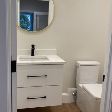 White Powder Room with Floating vanity