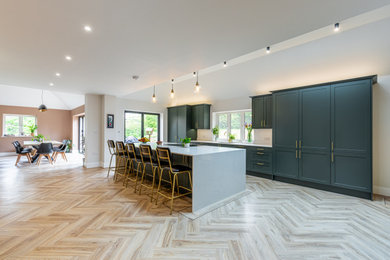 Inspiration for a traditional kitchen in Hertfordshire with quartz worktops, an island and white worktops.