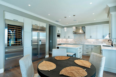 Open concept kitchen - mid-sized contemporary open concept kitchen idea in Boise with shaker cabinets and an island
